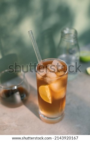 Cold drink with espresso and tonic in glass. Refreshing menu in coffee shop.