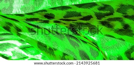 Silk fabric with leopard print. Green and white. Enjoy the jungle vibe with this khaki and black cheetah print silk chiffon Thrilling to the wild side the spotted image of the cheetah pushes forward