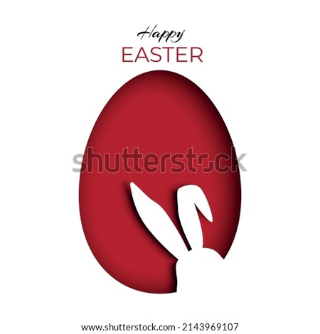 Silhouette of a bunny peeking inside a red Easter egg on carved or cut paper. Greeting card