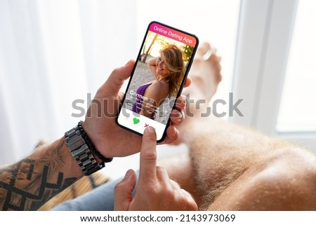 Man using online dating app on his mobile phone