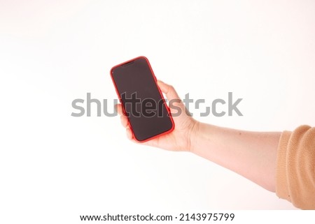 Woman hand holding black smartphone isolated on white background, clipping path Royalty-Free Stock Photo #2143975799