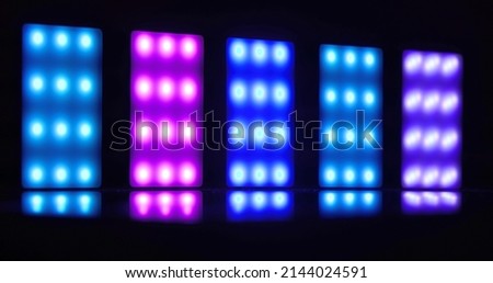 Colorful led lights lined up against dark background