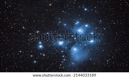 The Pleiades, open cluster in the constellation of Taurus. Elements of this picture furnished by NASA Royalty-Free Stock Photo #2144033189