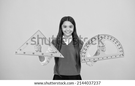 happy kid girl use protractor and triangle to learn mathematics, measurement