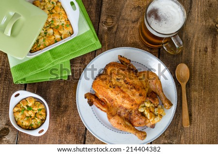 Grilled chicken whole and stuffed with herbs and nettles, czech beer
