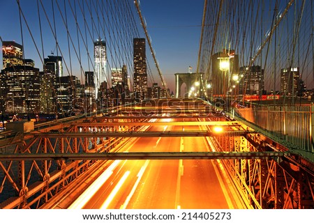 Traffic on the Brooklyn Bridge at night in New York