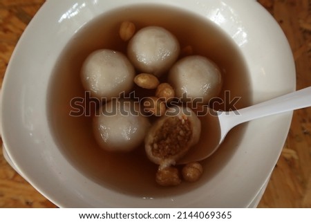 Ronde angsle, traditional warm dessert of sweet peanut filled glutinous rice ball in ginger syrup, also known as tang yuan. Royalty-Free Stock Photo #2144069365