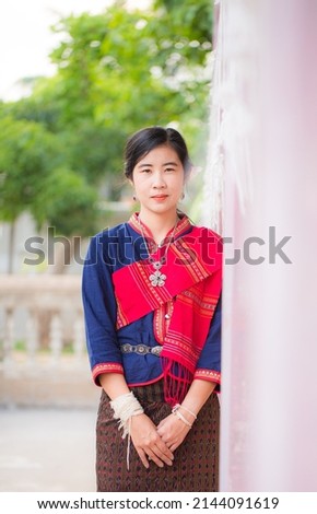 Portrait of asian girl with Thai local traditional dress, famous in countryside of Thailand,Ladies in traditional Thai costume in handmade flower baskets