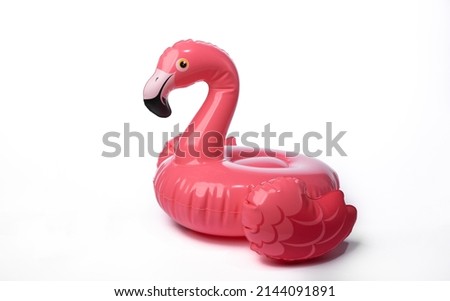 Inflatable pink flamingo isolated on white background Royalty-Free Stock Photo #2144091891