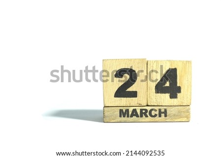 March 24. 24th day of the month, wooden calendar isolated on a white background with shadow.