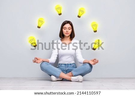 Teamwork business collaboration problem solving concept young girl sitting floor lotus position meditating inner harmony brilliant idea Royalty-Free Stock Photo #2144110597