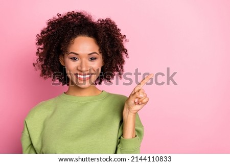 Photo of young pretty girl indicate finger empty space promo direct select banner isolated over pink color background