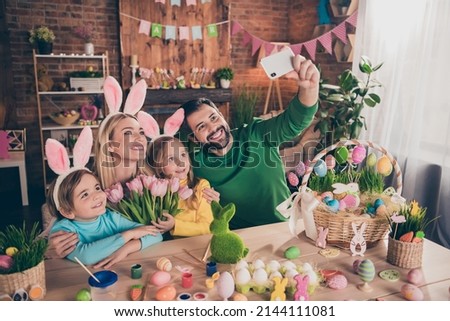 Portrait of beautiful full family make selfie portrait bunny ears fresh tulips gift present home indoors