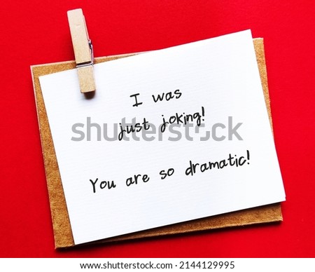 Handwriting note I WAS JUST JOKING, YOU ARE SO DRAMATIC! gaslighting way to accuse or emotional abuse others to question their beliefs or doubt their perception and become distressed Royalty-Free Stock Photo #2144129995