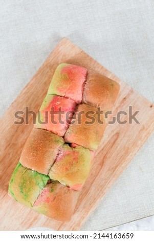 Rainbow Japanese Milk Bread on a white background. Food Baking concept Fresh baked organic homemade soft milk loaf bread.	
