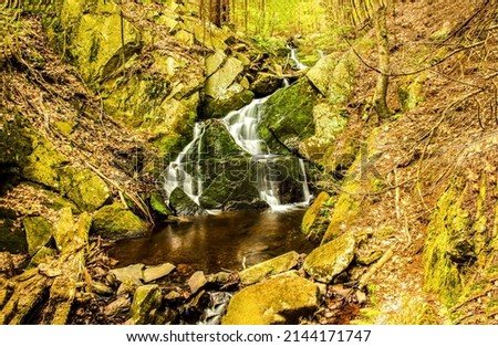 Waterfall on mossy rocks view. Waterfall cascade on rocks. Forest waterfall cascade on rocks. Waterfall cascade in forest Royalty-Free Stock Photo #2144171747
