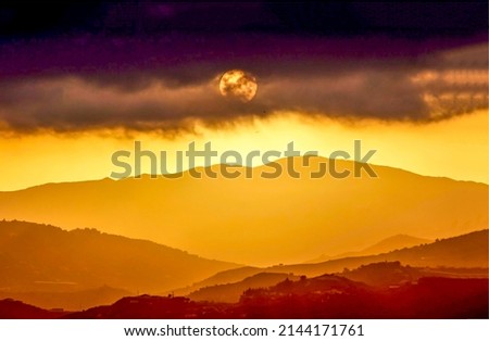 Sunset over the mountain peaks. Night fall at sunset landscape. Golden sunset landscape. Beautiful sunset landscape Royalty-Free Stock Photo #2144171761