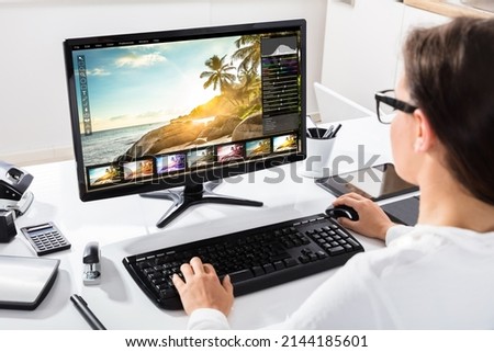Graphic Designer Editing Photo On Desktop Computer