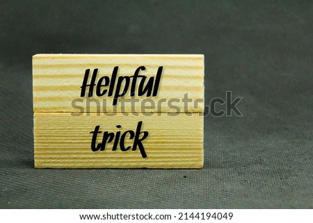 two wooden boards with the word Helpful trick