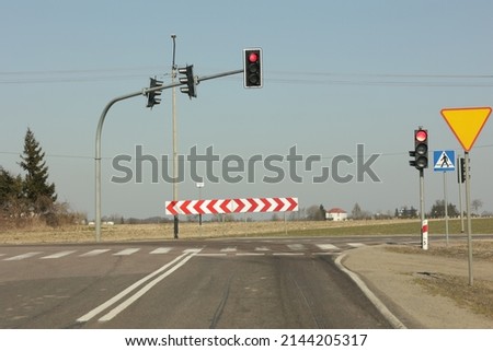 Road signs: pedestrian crossing, traffic lights, sharp turn right, sharp turn left, yeld