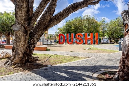 DUSHI written in big red and blue letters in the city center of Willemstad