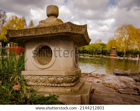 stone lantern in the park near the water