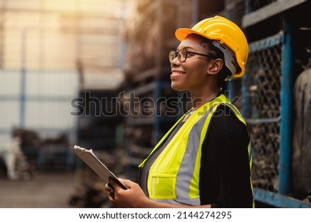 Happy Black African women engineer worker enjoy working in factory industry. Royalty-Free Stock Photo #2144274295