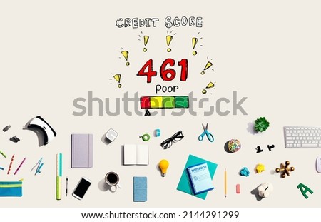 Poor credit score theme with collection of electronic gadgets and office supplies