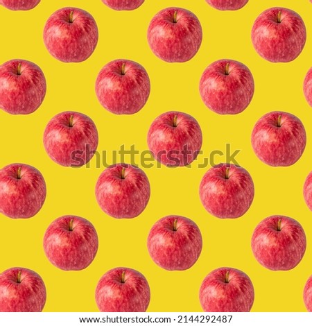 seamless pattern with red apple on the bright yellow background for wallpaper or wrapping-paper, autumn harvest