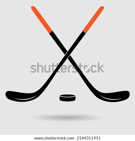 crossed ice hockey sticks,hockey sticks vector illustration.isolated on blue background.