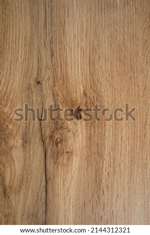 Wooden background texture. Light brown surface of old knotty wood with a natural color.