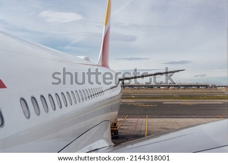View of an airplane on the runway of the airport. Transportation, aircraft and travel concept.