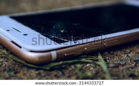 cell phone or mobile with the split screen on the ground
