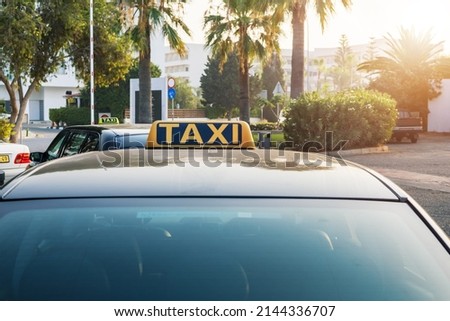 Taxi in the parking lot near hotel. Summer vacation, trip, rest. Concept of transfer taxi car.
