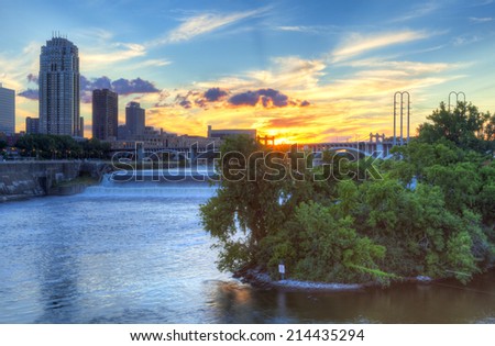 Sun is setting over Mississippi River, in Minneapolis.