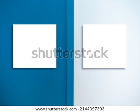 Two mockup empty blank white square border frame with same size hanging on two color wall backgrounds, white and blue. Mock-up poster, picture, photo frames.
