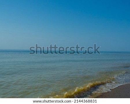 The Beauty of morning waves. Seascape with empty coastline of sand beach in Qatar. The waters edge sealine beach