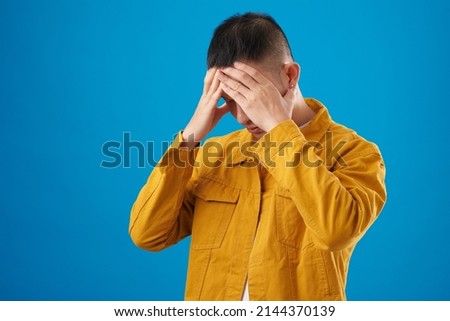 Portrait of stressed almost crying young man suffering from memories about the worst day of his life Royalty-Free Stock Photo #2144370139