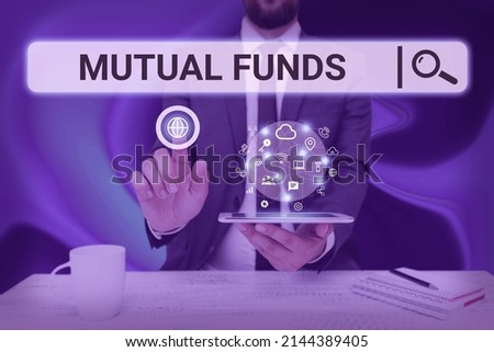 Conceptual display Mutual Funds. Business idea An investment program funded by shareholders Individual Stocks Man holding Screen Of Mobile Phone Showing The Futuristic Technology.