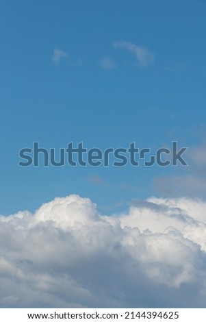Cover page with soft blue sky with illuminated clouds as a background