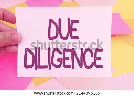 Text caption presenting Due Diligence. Business concept Comprehensive Appraisal Voluntary Investigation Audit Multiple Assorted Collection Office Stationery Photo Placed Over Table