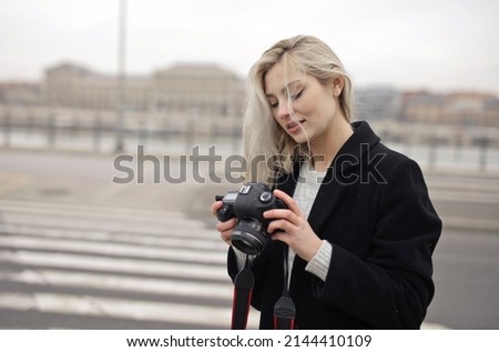 young woman with a digital camera