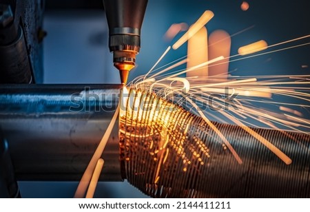 CNC Laser cutting of metal, modern industrial technology Making Industrial Details. The laser optics and CNC (computer numerical control) are used to direct the material or the laser beam generated. Royalty-Free Stock Photo #2144411211
