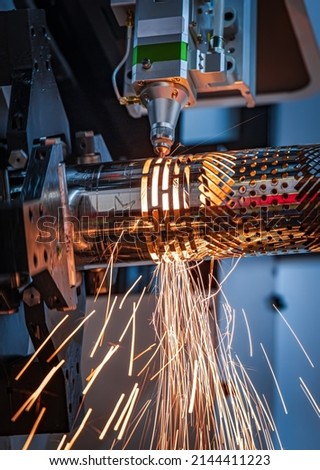 CNC Laser cutting of metal, modern industrial technology Making Industrial Details. The laser optics and CNC (computer numerical control) are used to direct the material or the laser beam generated. Royalty-Free Stock Photo #2144411223