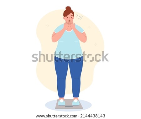 Obese woman stands on the scales, shocked by the weight gain. She upset because she was gaining weight. Excess weight problems concept.  Royalty-Free Stock Photo #2144438143