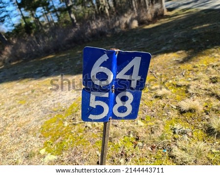 A civic stake with the numbers 64 and 58 on it.