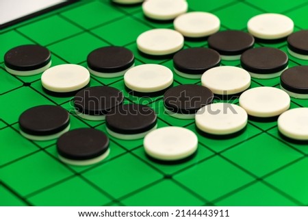 Othello board with black and white stones