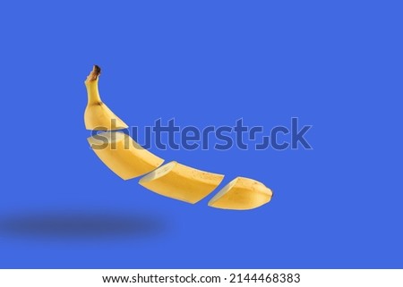 Banana, slices banana on teh royal blue becground. . Minimal fruite  concept.