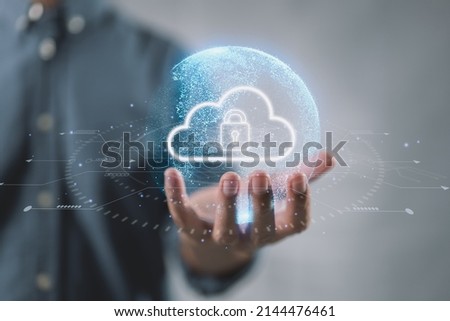 Cloud computing technology database storage security concept Backup transfer. There is a large cloud icon on the right in an abstract world on businessman. Royalty-Free Stock Photo #2144476461