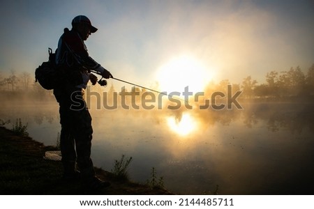 Fishing background. Fisherman catching on a lake. Royalty-Free Stock Photo #2144485711